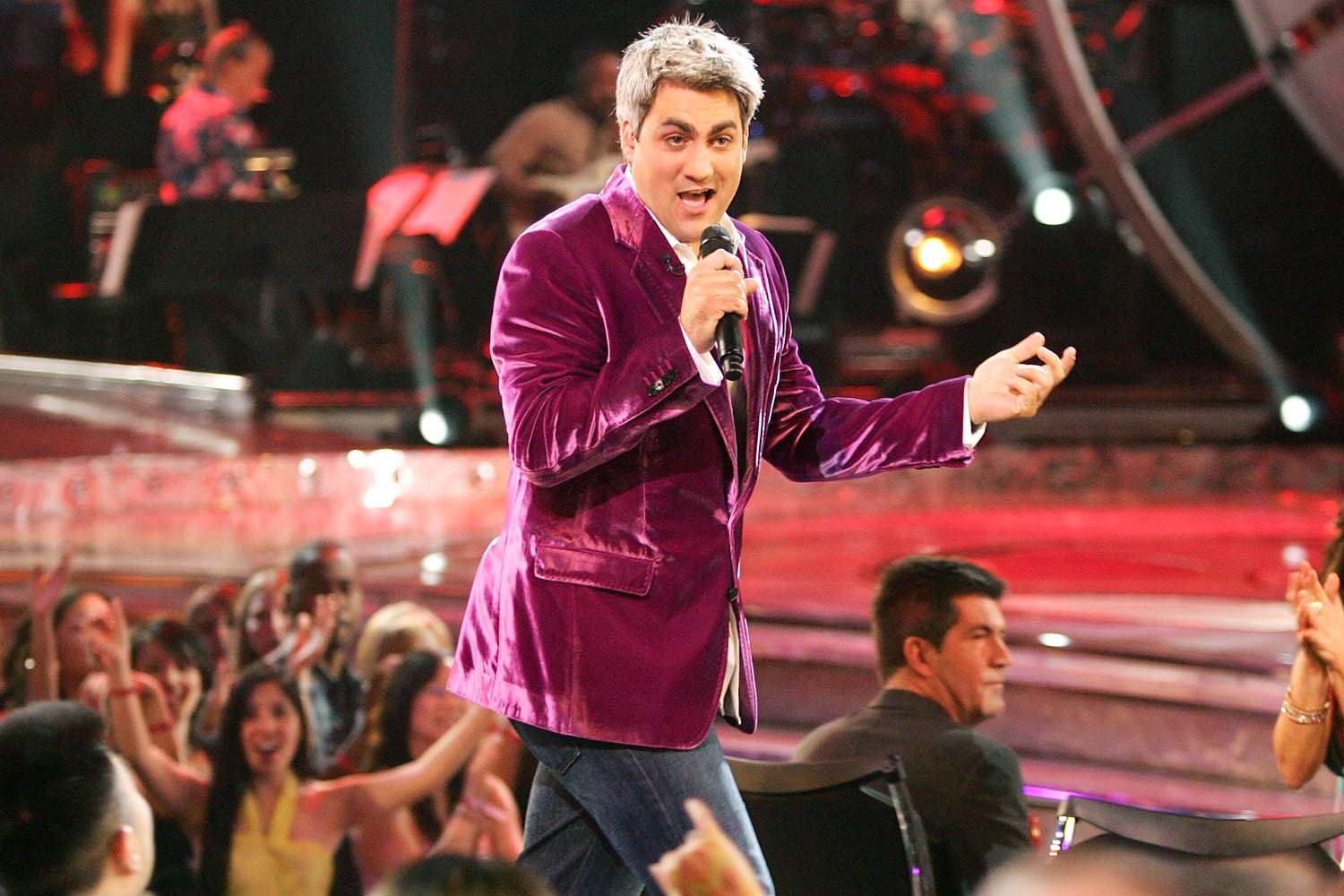 An American Idol alum performing live on an outdoor stage for a summer crowd