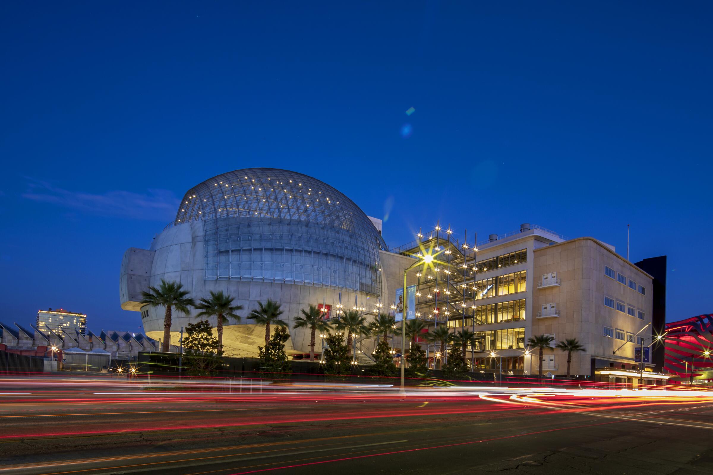 Attendees arriving at a nighttime awards-season screening event outside a major Los Angeles film museum