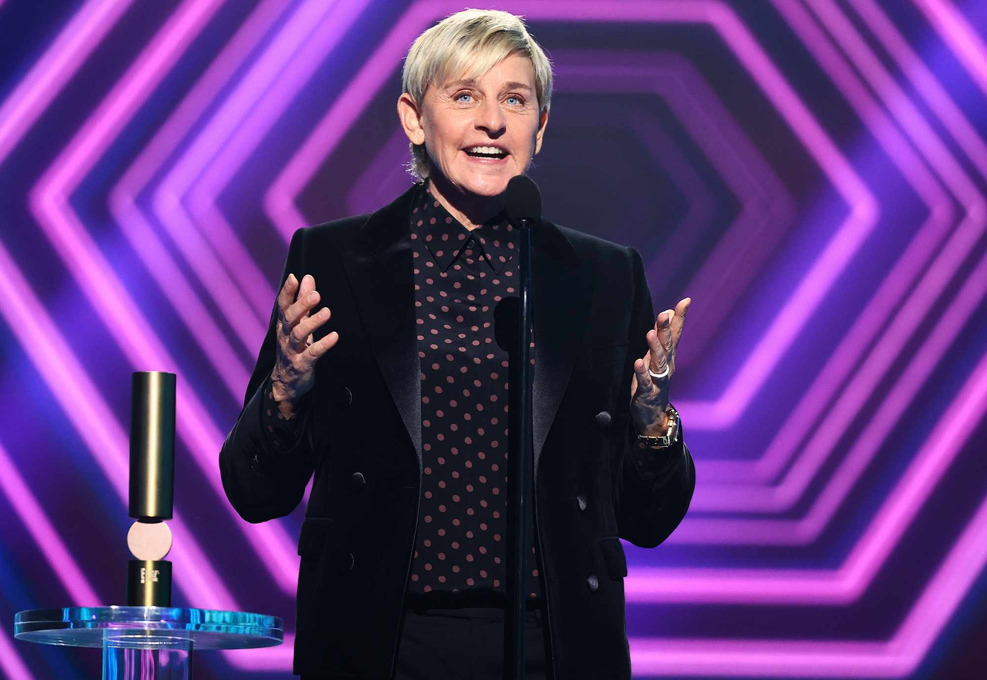 Ellen DeGeneres poses for a photo at a public event.