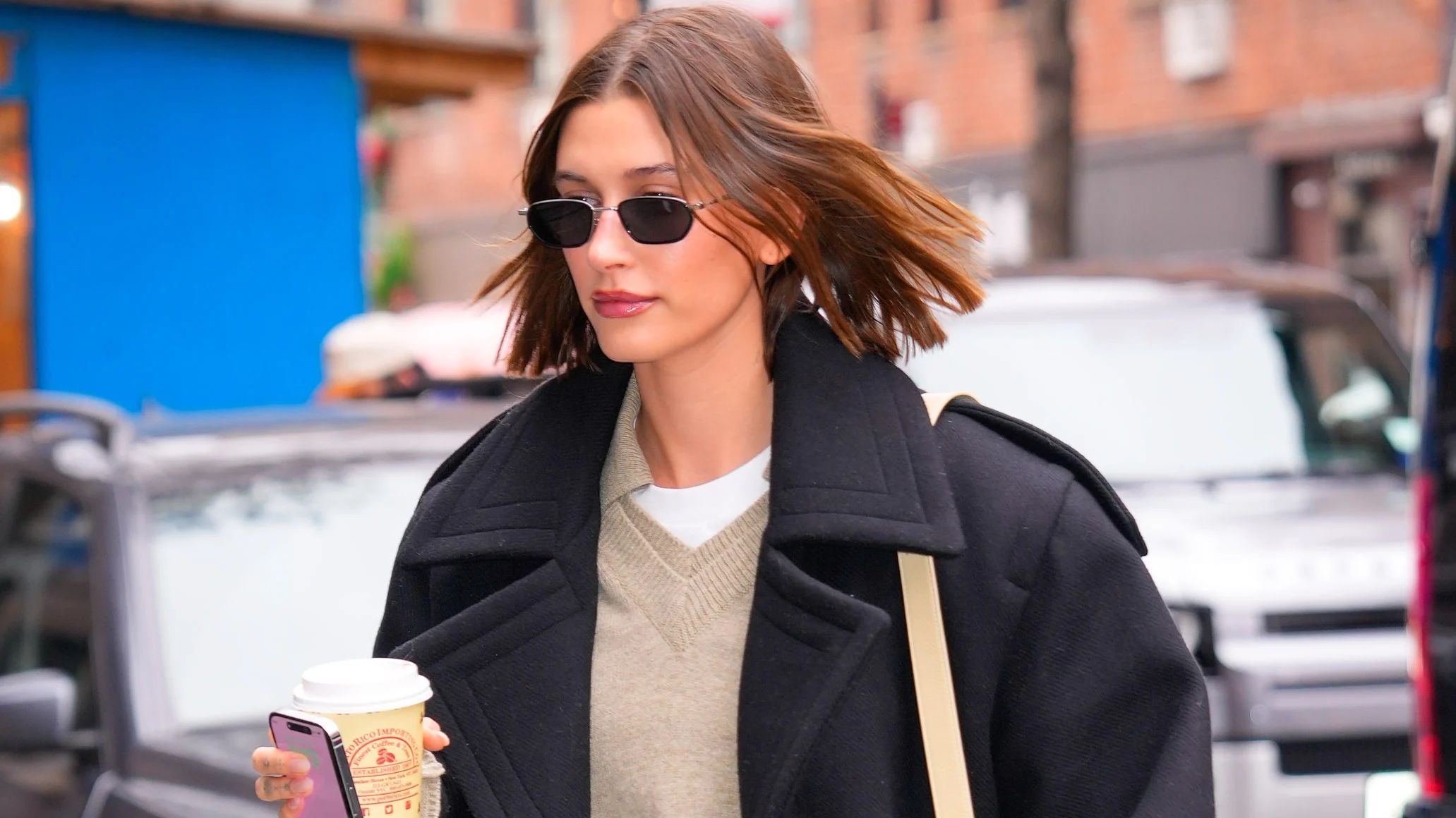 Hailey Bieber photographed in public with a shorter bob-like haircut, showing a cleaner, more cropped silhouette than her previous longer styles.