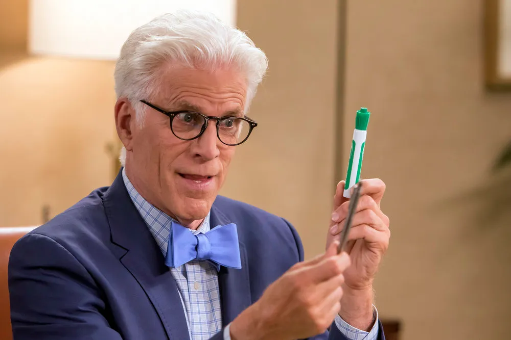Ted Danson as Michael in The Good Place, mid-scene with an expressive look that blends comedy with seriousness