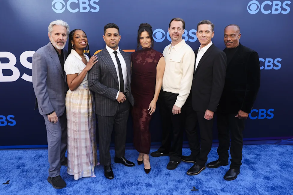 The NCIS team stands together in a promotional group shot.