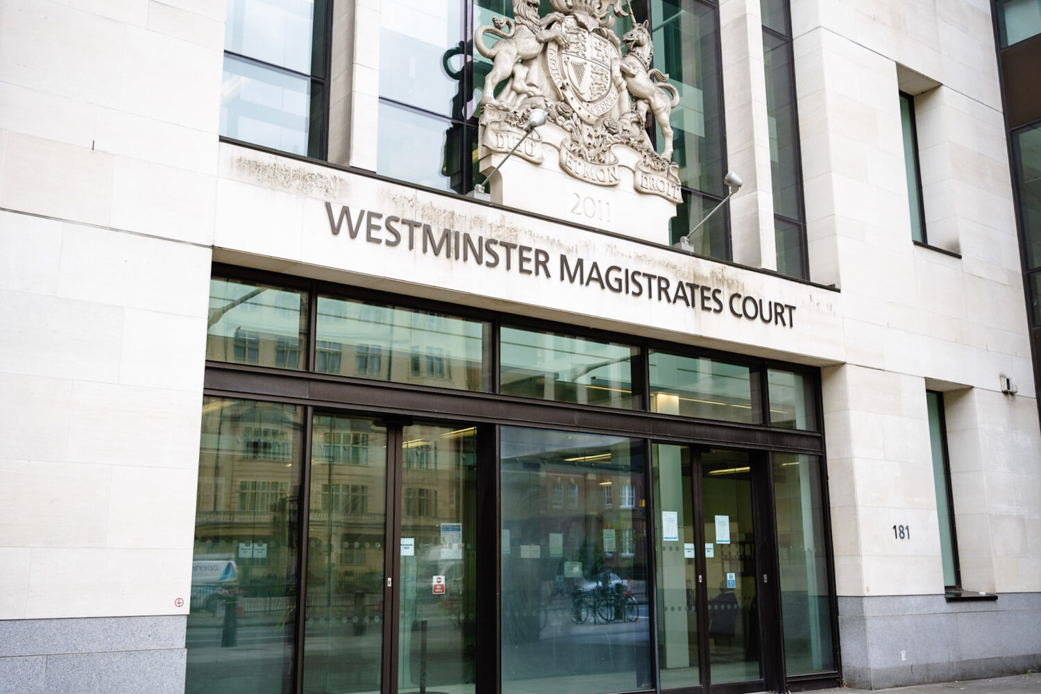The exterior of Westminster Magistrates’ Court in London with pedestrians entering through the main doors