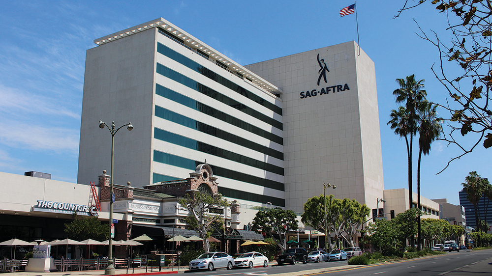 The exterior of the SAG-AFTRA headquarters building in Los Angeles on a clear day, with the building signage visible